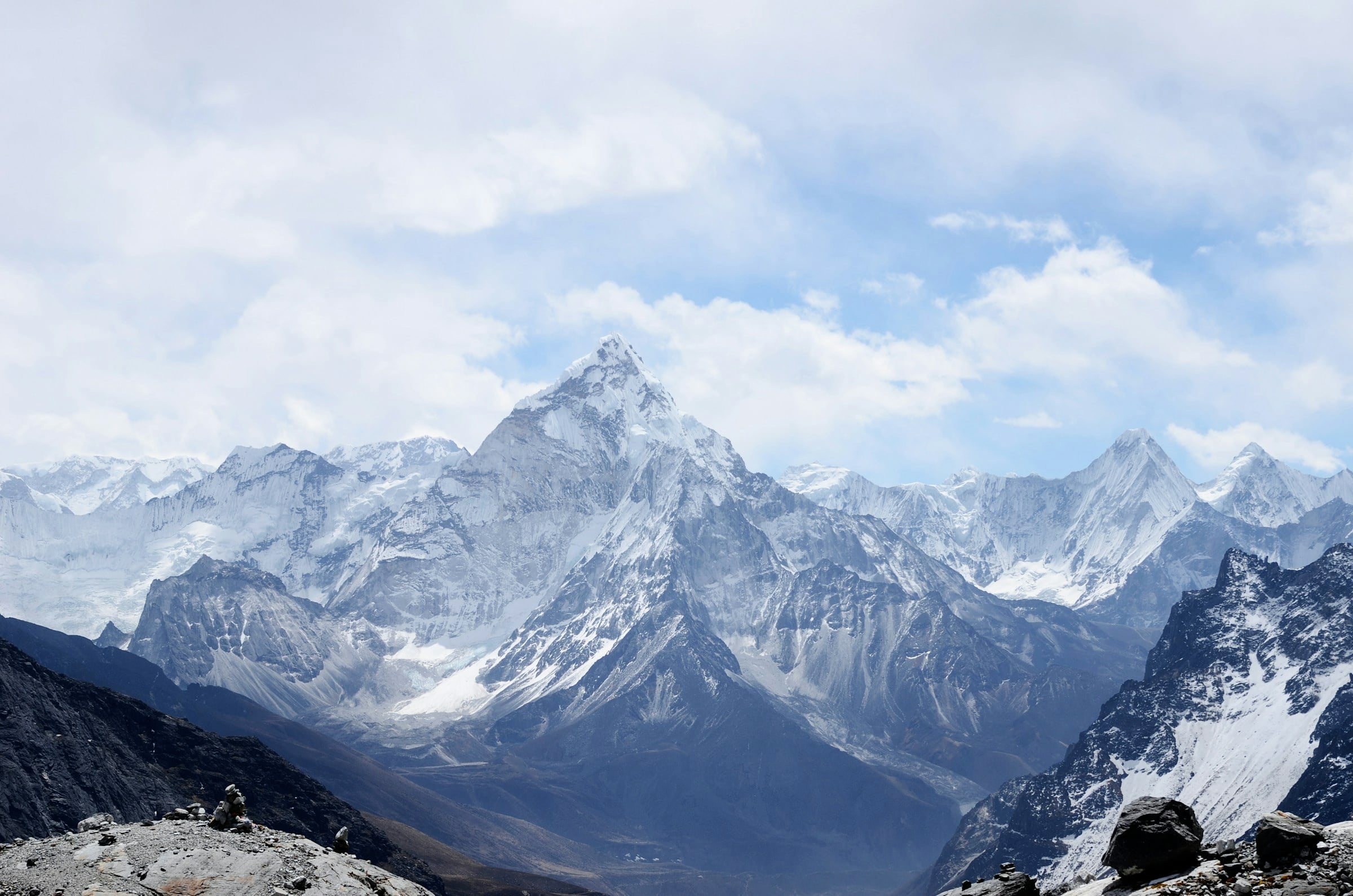 Snow-covered mountain peaks beneath a winter sky